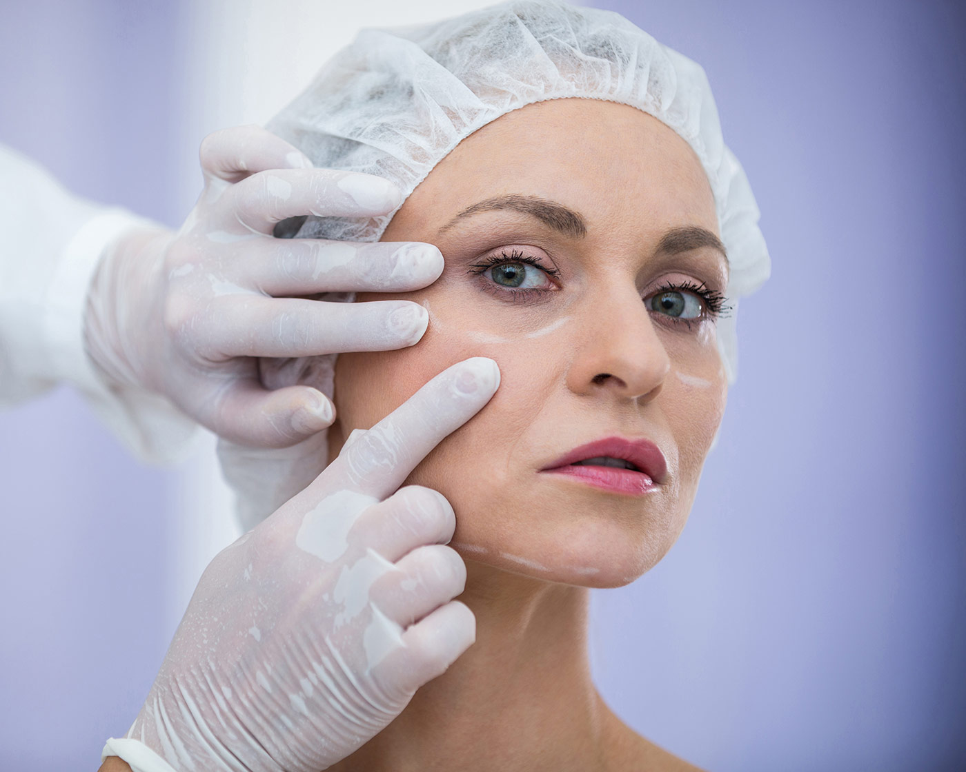 doctor ayfer ulcay yuz estetigi examining female patients face cosmetic treatment k 1
